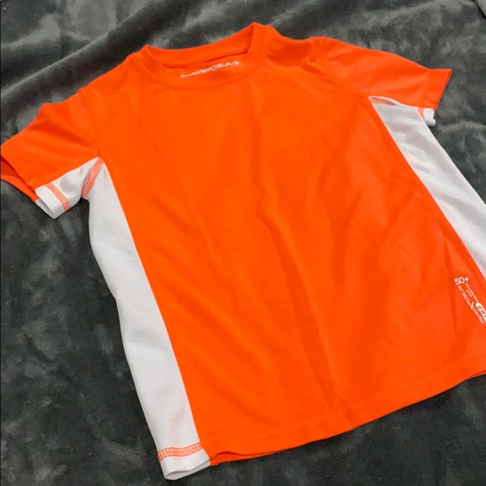 Bright neon orange rashguard